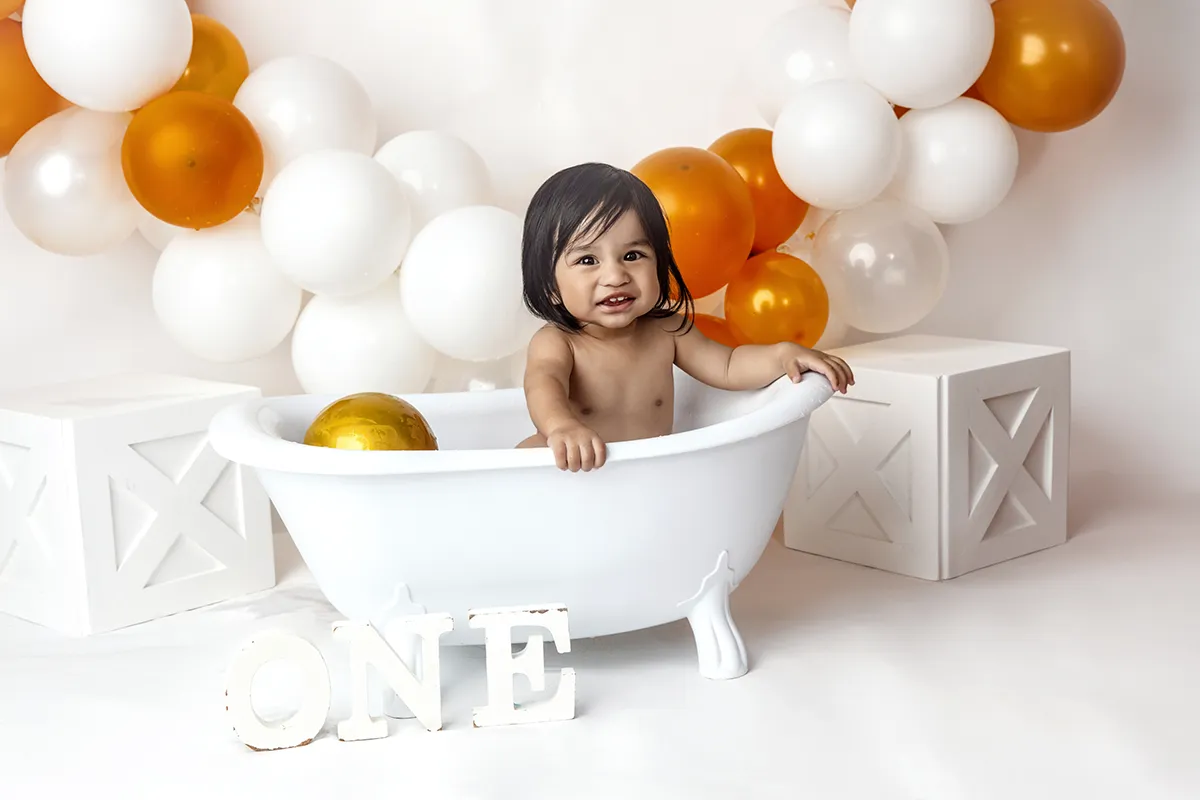 Baby enjoying a cake smash session in the Photo Hive Auckland studio