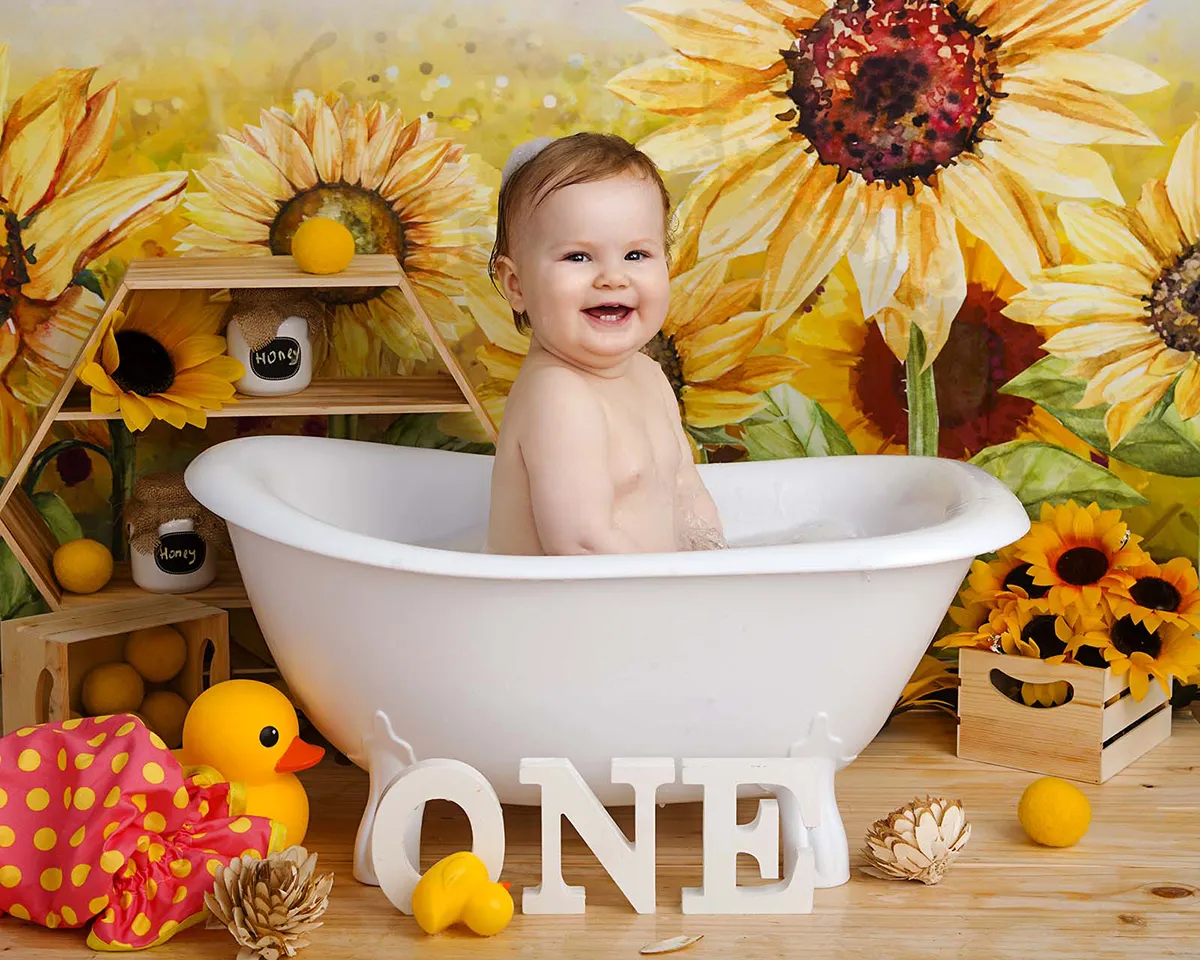 Baby celebrating first birthday during cake smash photography session in Auckland